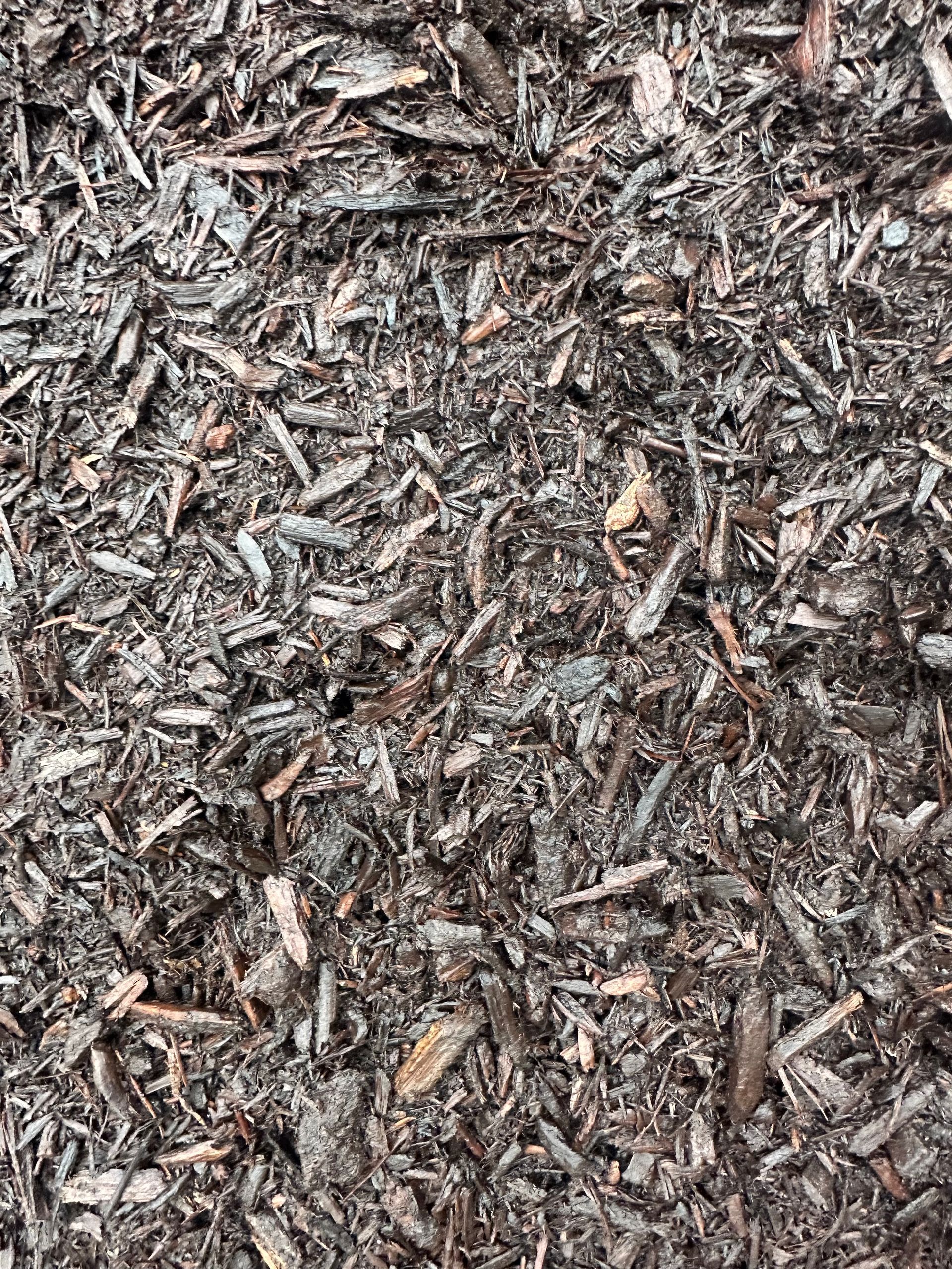 Close-up of shredded dark wood mulch.