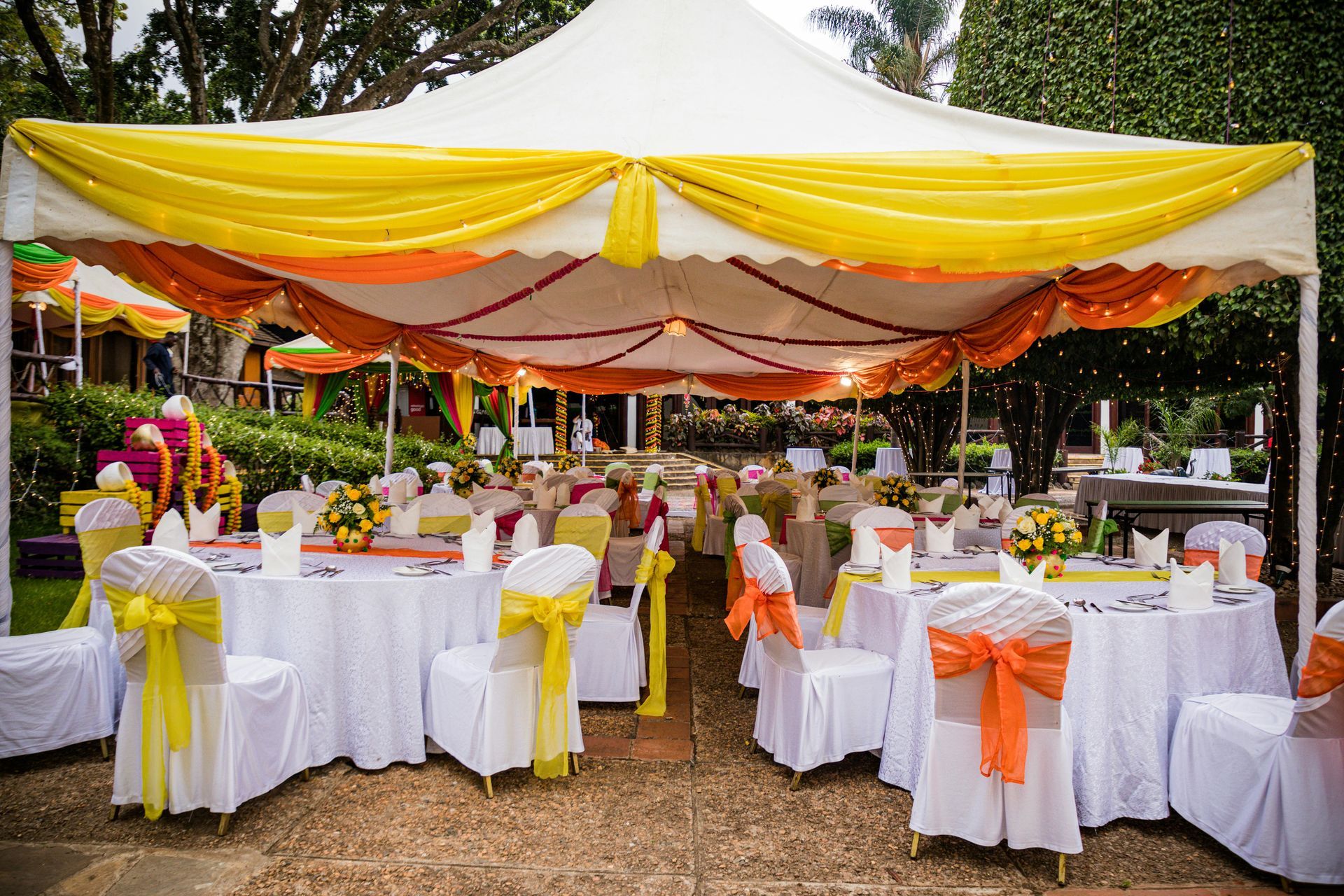 tent with tables and chairs in an event