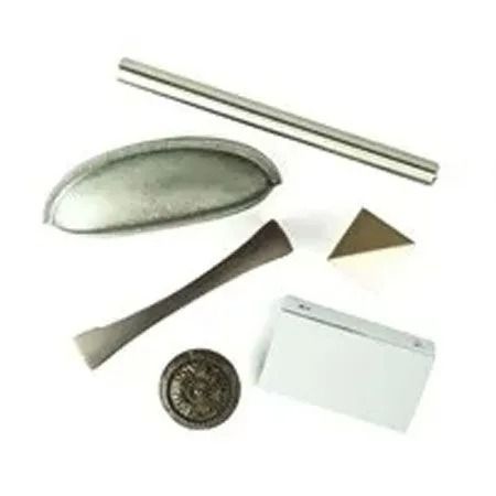 Cabinet hardware samples in various shapes and finishes.
