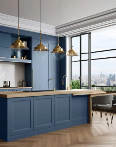 Blue kitchen with wooden countertops, brass pendant lights, and a cityscape view.