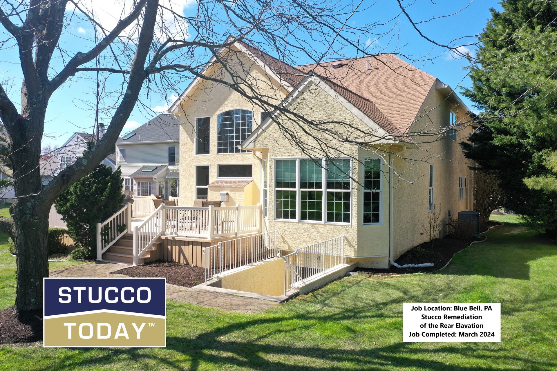 Yellow stucco house with wooden deck, and a stucco-branded logo in the lower left.