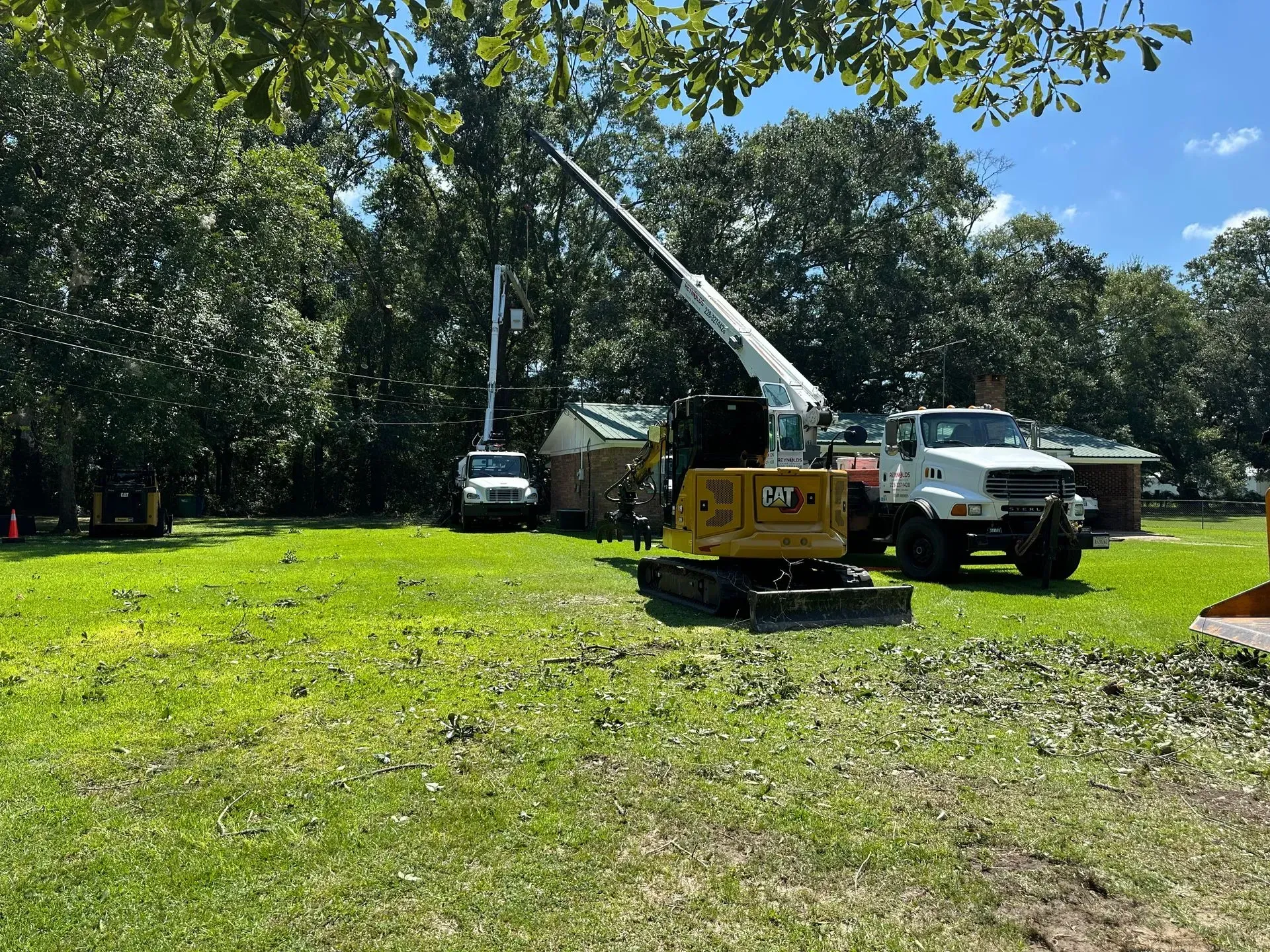 Construction site with a truck crane and a mini excavator.