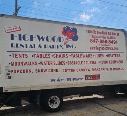 Highwood Rentals truck with event equipment listings and logo on the side outdoors