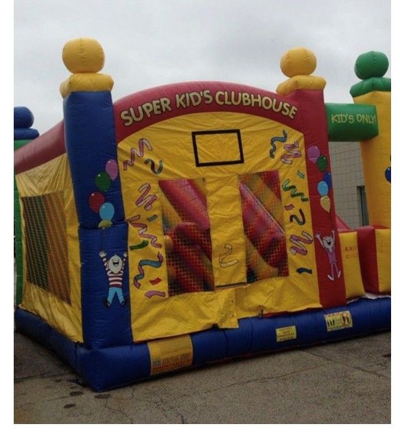 A colorful, inflatable bounce house with yellow walls, a blue base, and the text SUPER KID'S CLUBHOUSE on top.
