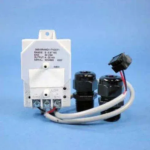 White electrical relay module with black cylindrical components and white cables on a blue background