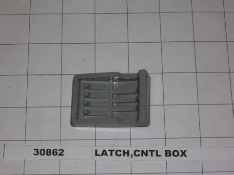 Gray plastic latch labeled “LATCH, CNTL BOX” on a grid background.