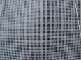 Close-up of a gray mesh screen with a fine square grid pattern.