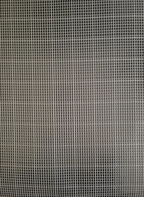 Close-up of a gray mesh screen with a fine square grid pattern