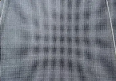 Gray mesh fabric with a fine grid pattern and two vertical seams