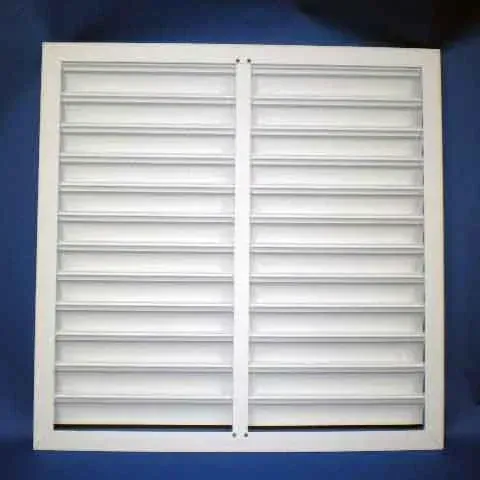 White louvered window shutters with a central divider on a blue background