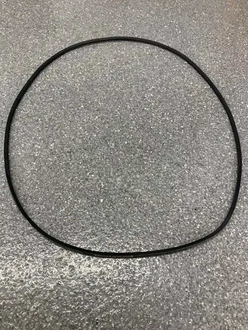 Black rubber O-ring on a gray speckled surface