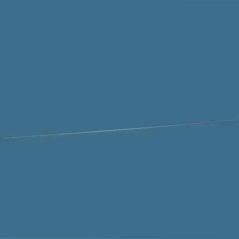 Solid blue surface with a faint diagonal white streak across the middle.