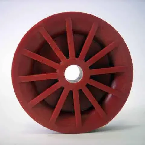 Red spoked wheel or pulley with a central hole on a white background