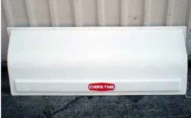 White car front bumper with a red center badge, viewed straight on.