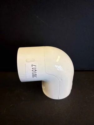 White PVC elbow pipe fitting on a black background, marked with the number 30107.