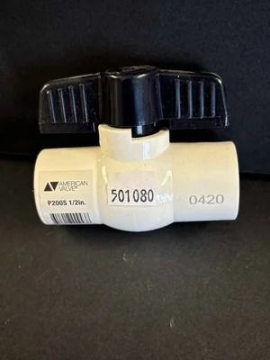 White and black plastic valve with a black handle on a dark background