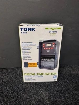 Tork digital time switch box on a dark surface, shown in white packaging with product image and text.