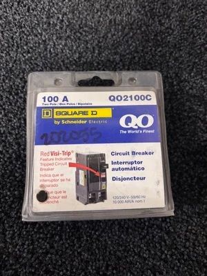 Square D 100A QO1100C circuit breaker in clear packaging on dark carpet