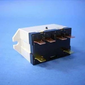 White electrical relay switch with black face and copper terminals on a blue background