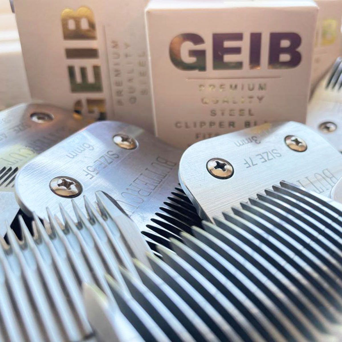 GEIB clipper blade heads and packaging in a close-up product display