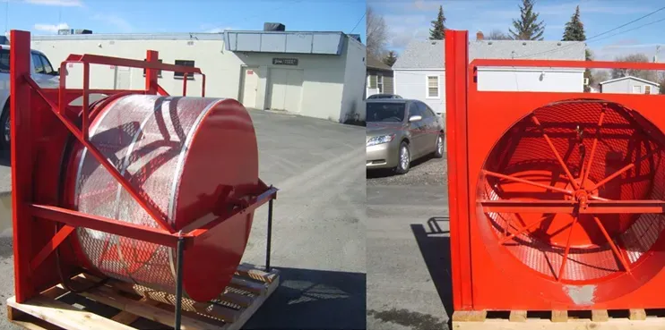 Two red industrial sieves, one side view, the other front, on a pallet outdoors.