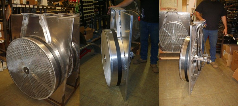 Three stainless steel industrial components with a mesh surface and a person holding one.
