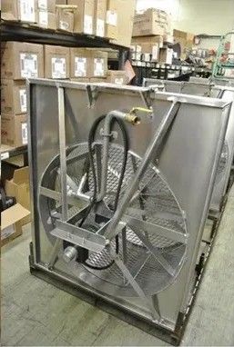 Stainless steel industrial fan unit on a pallet, possibly for cooling.