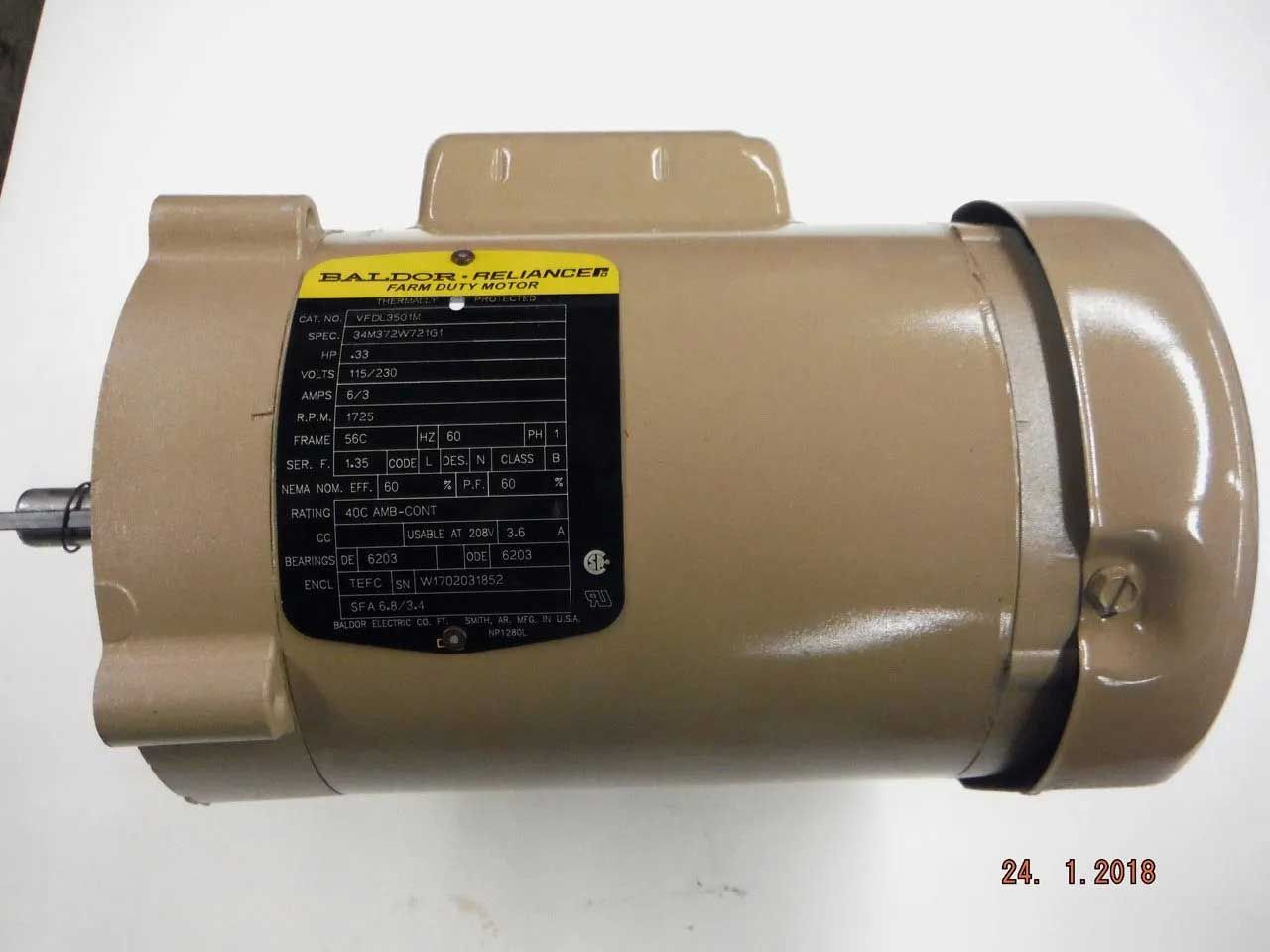 Tan electric motor with a black label, likely used in industrial applications.