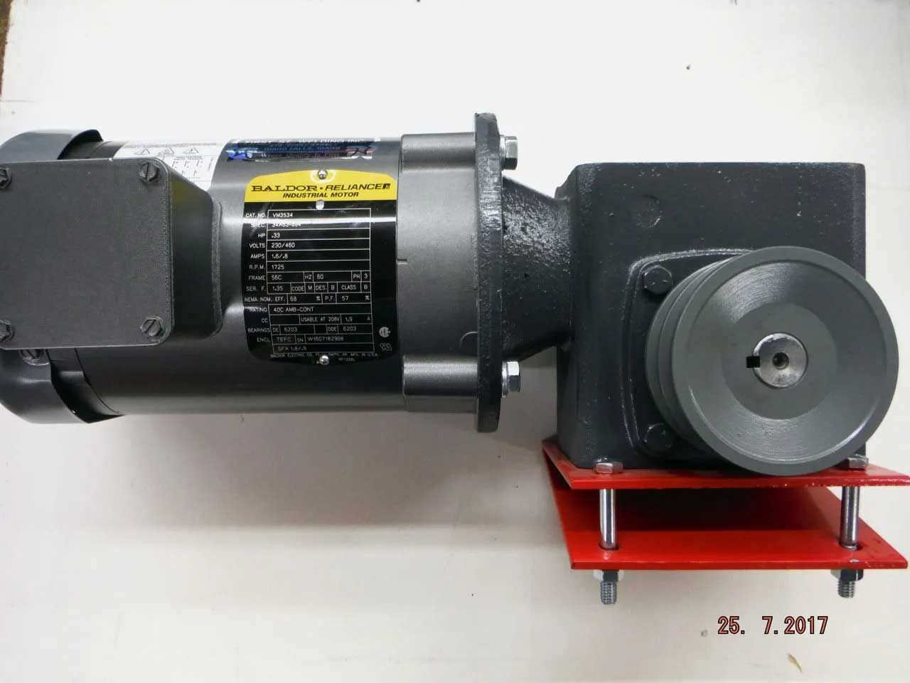 Electric motor with a gearbox and pulley system, mounted on a red bracket.