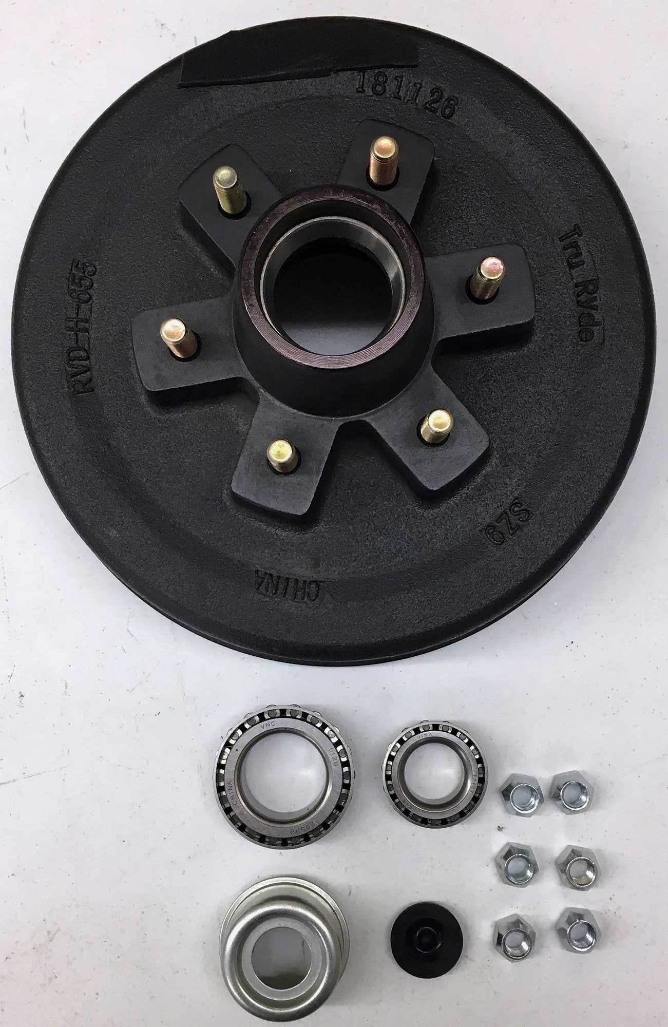 Trailer drum brake assembly with bearings, nuts, and dust cap on a white background.