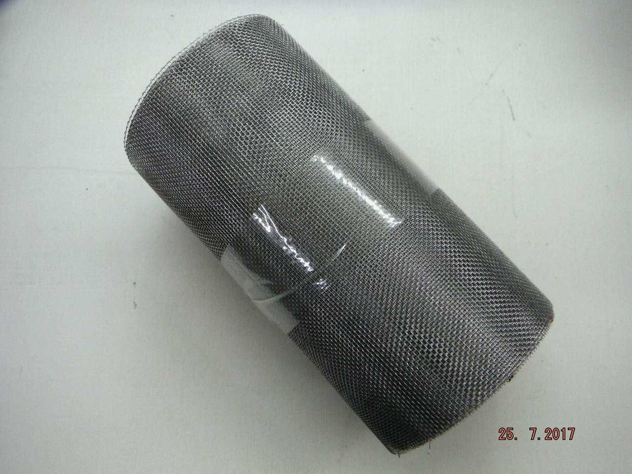 Rolled-up roll of dark gray metal mesh, possibly for screening or filtering, against a white background.