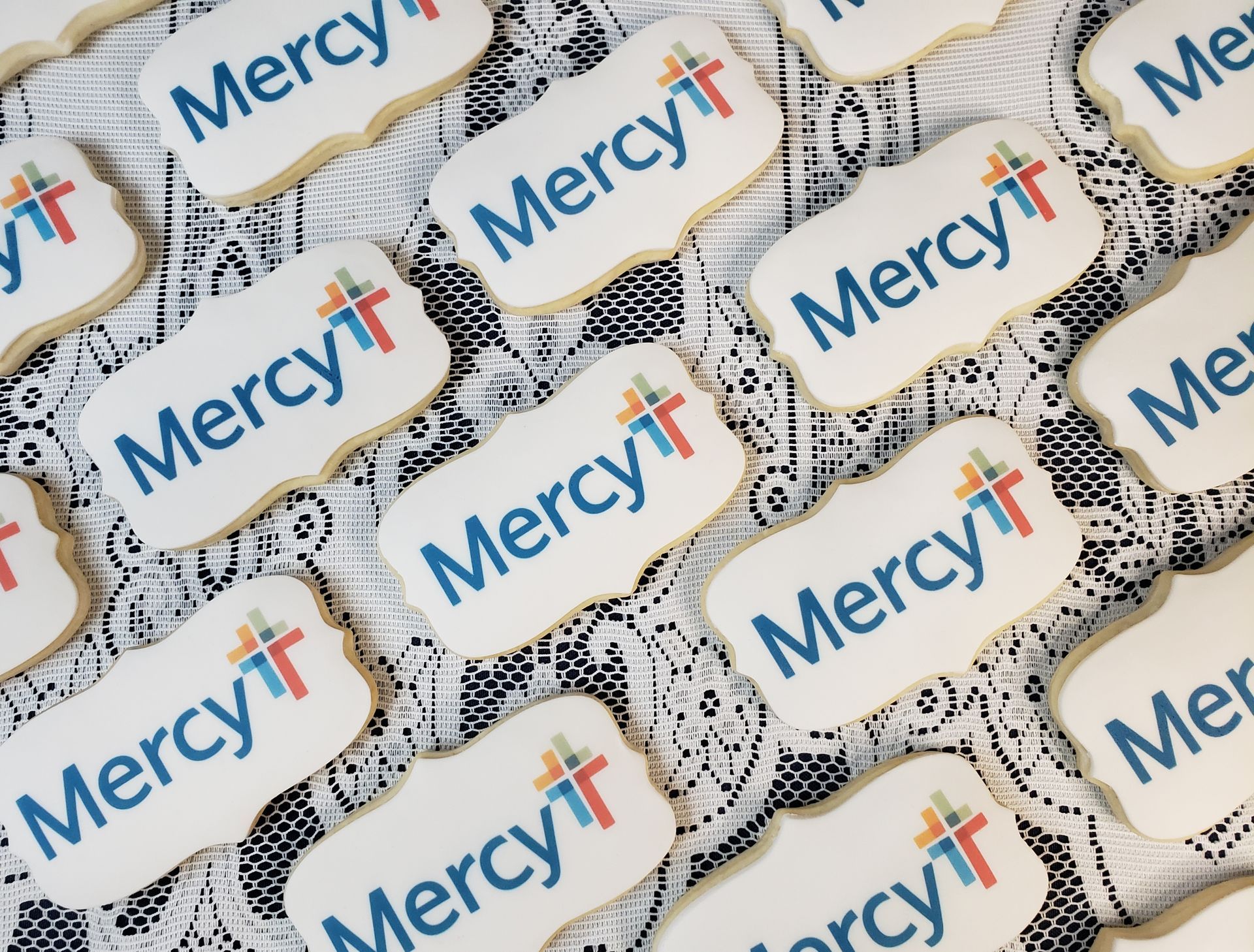 a bunch of cookies with the word mercy on them