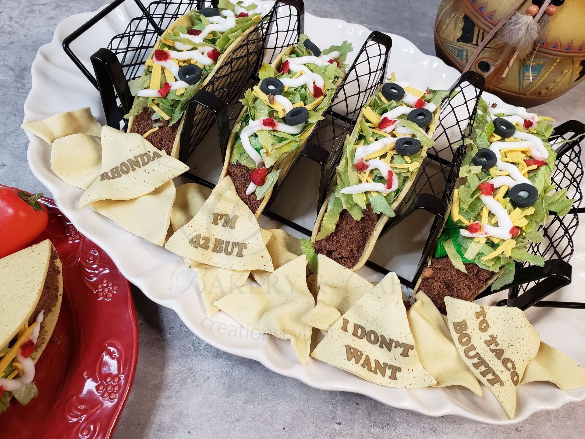 A cake shaped like a folded hard-shell taco