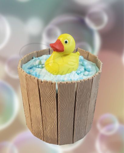 Yellow rubber duck in a wooden bucket filled with blue and white beads, with bubble background
