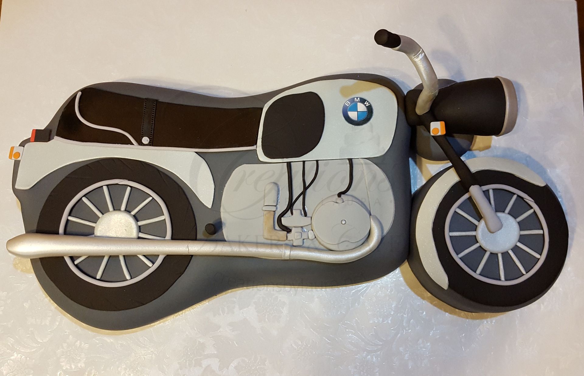 Illustration of a black-and-white BMW motorcycle, side view on a light background