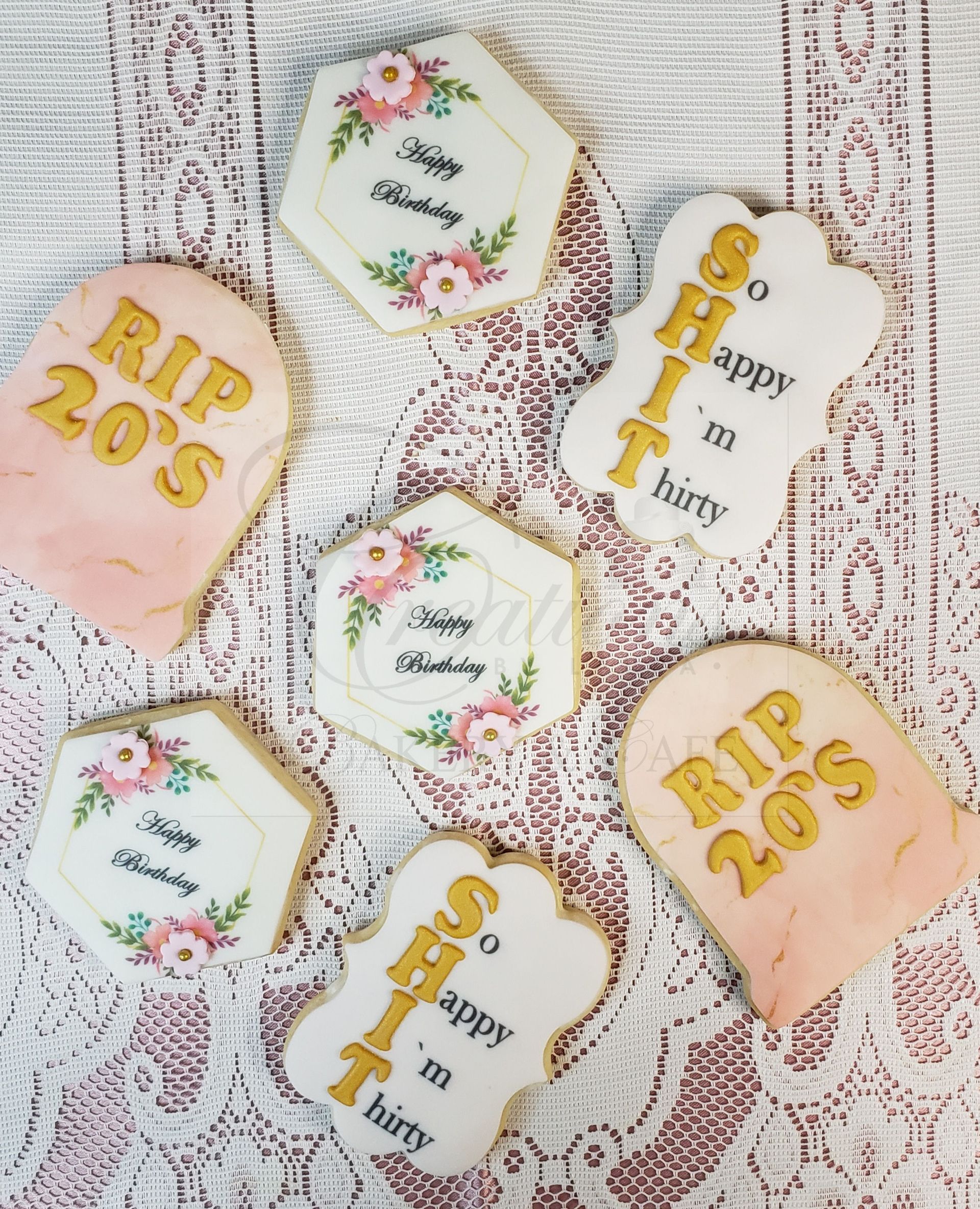 Assorted pastel birthday cookies with gold lettering, floral accents, and “RIP 20’s” and “Happy Birthday” designs