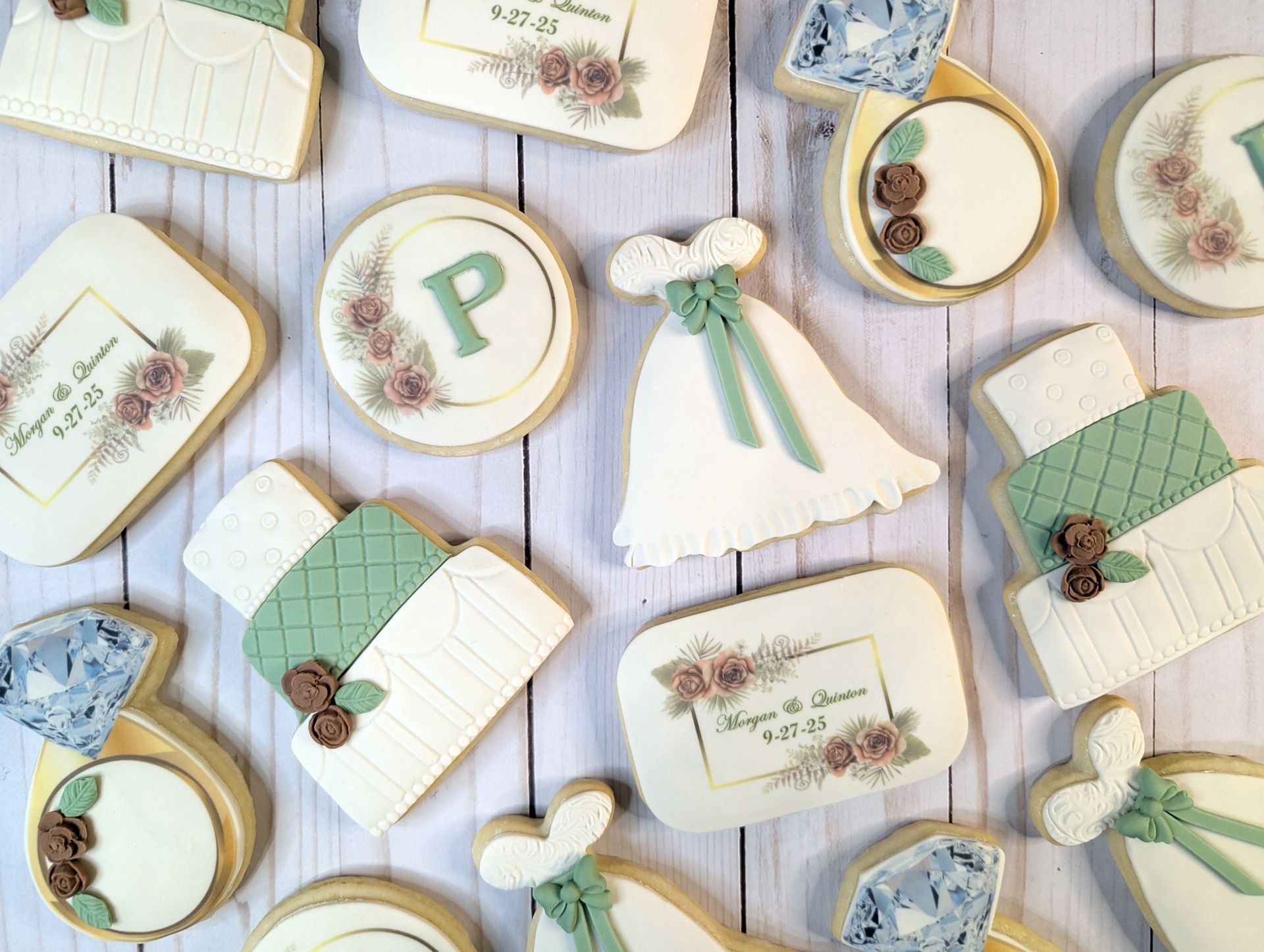 a bunch of wedding themed cookies on a table