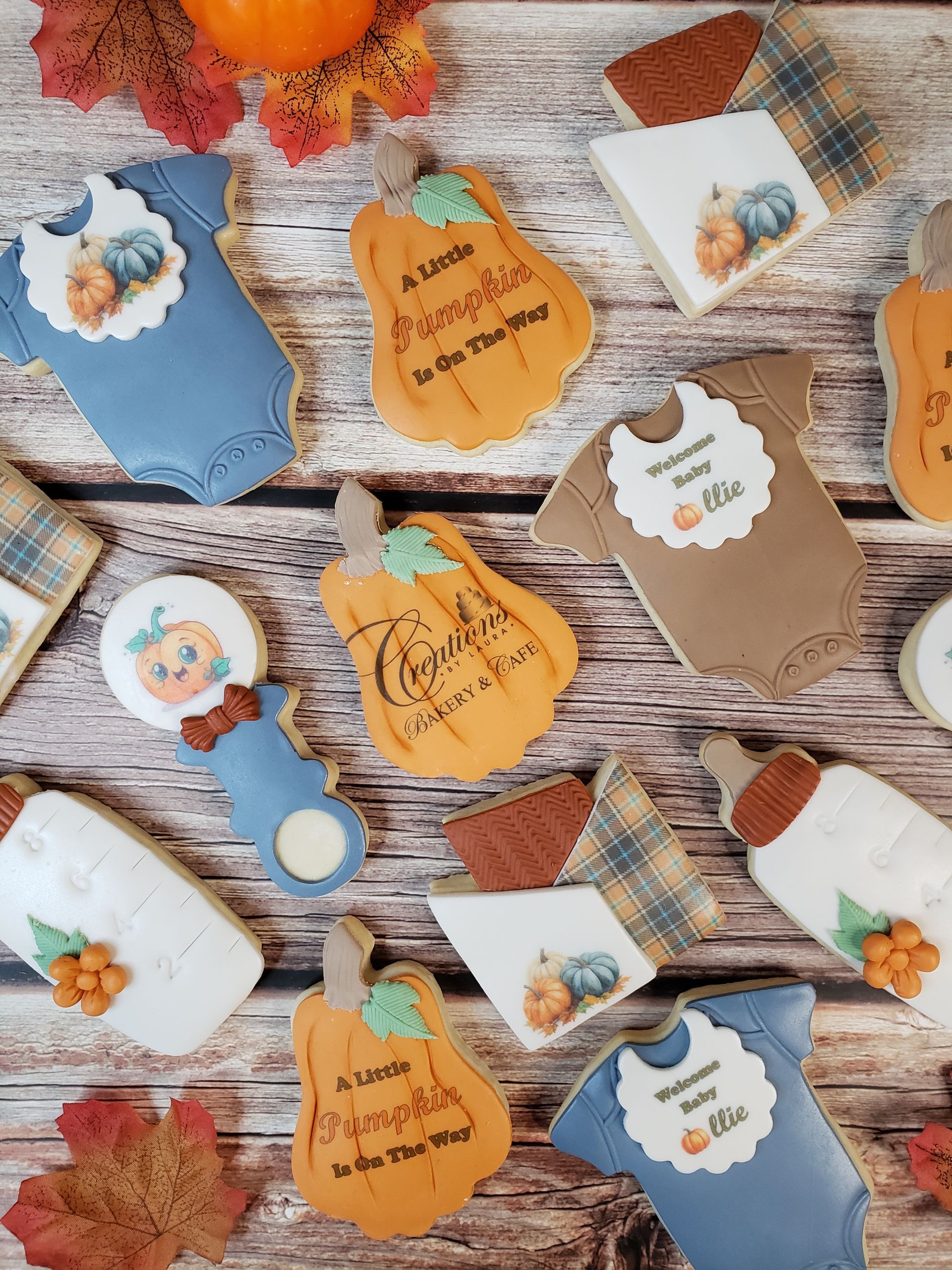 Fall-themed tags and cards with pumpkins, leaves, and autumn designs on a rustic wooden surface