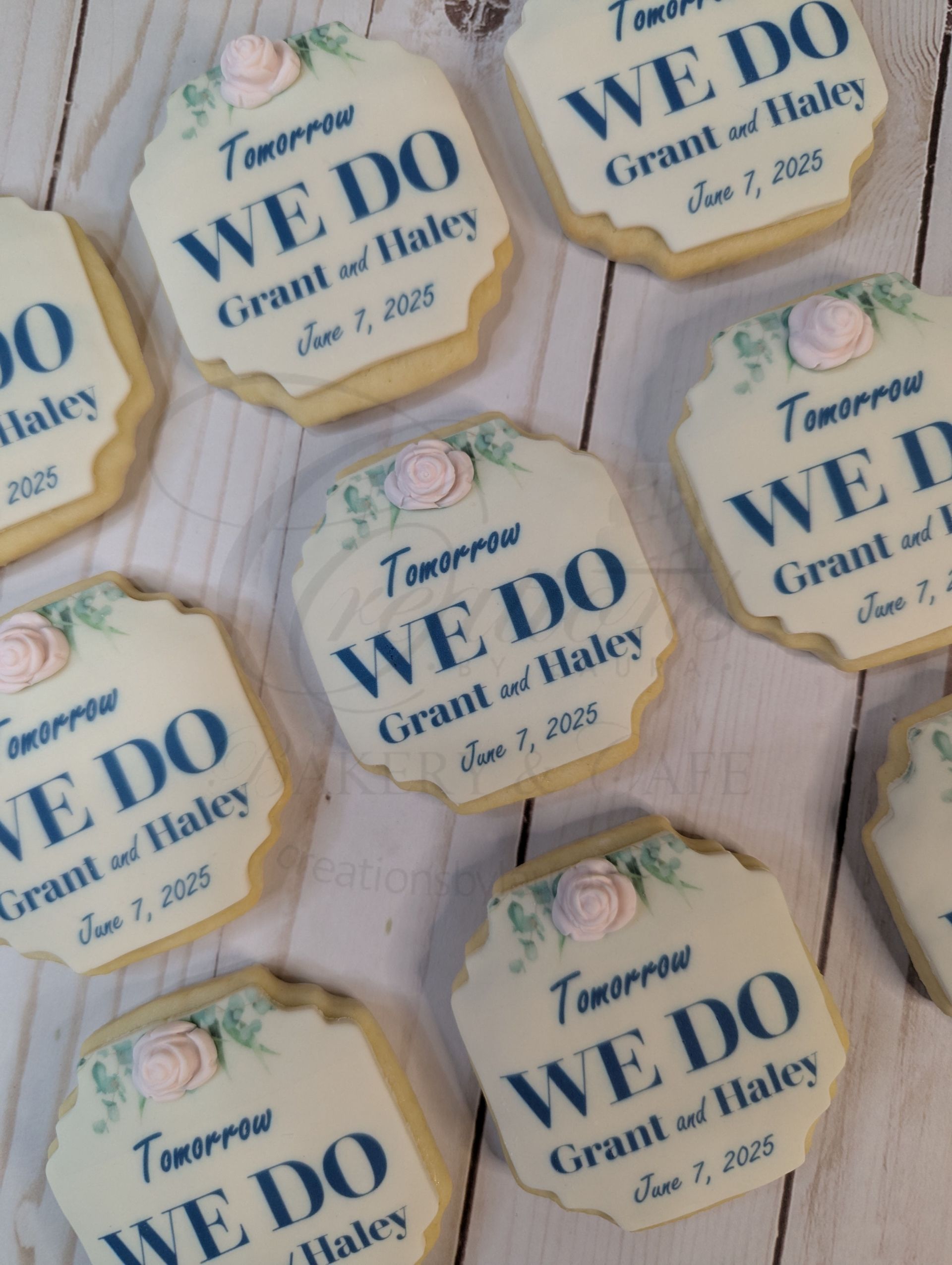 Stacked octagonal wedding favor labels reading We Do in blue on white with gold trim