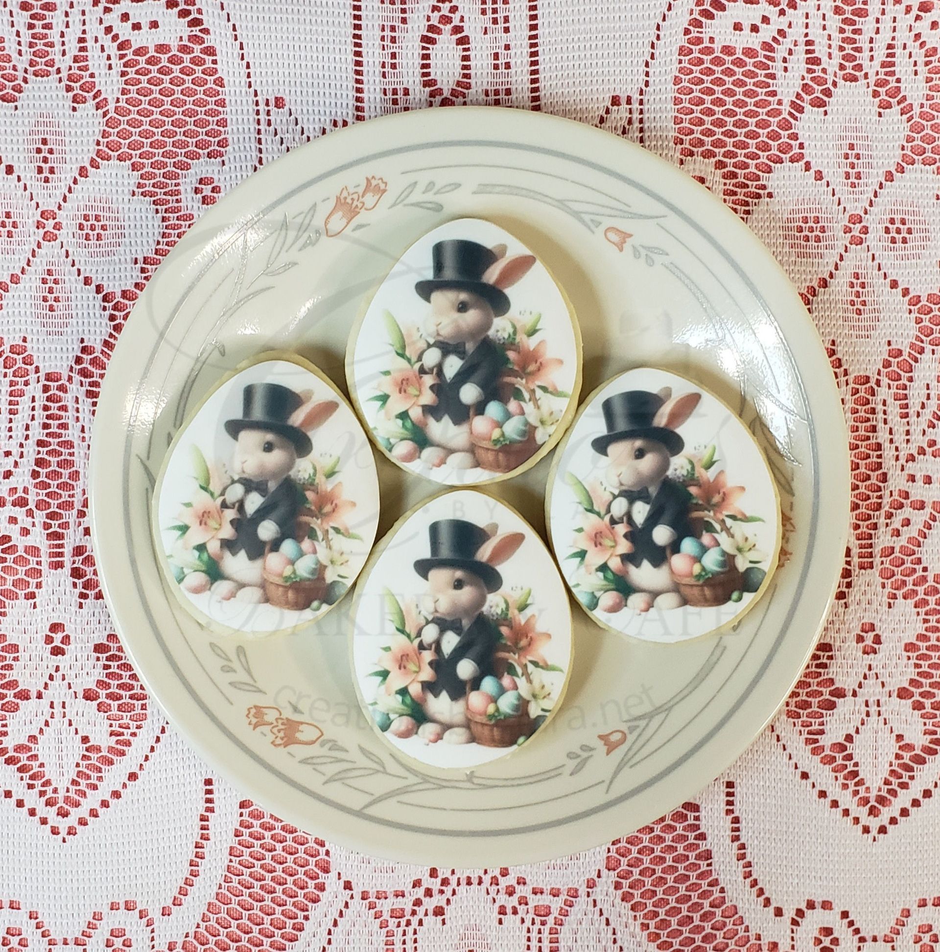 Decorative plate with three snowman illustrations on a lace tablecloth.
