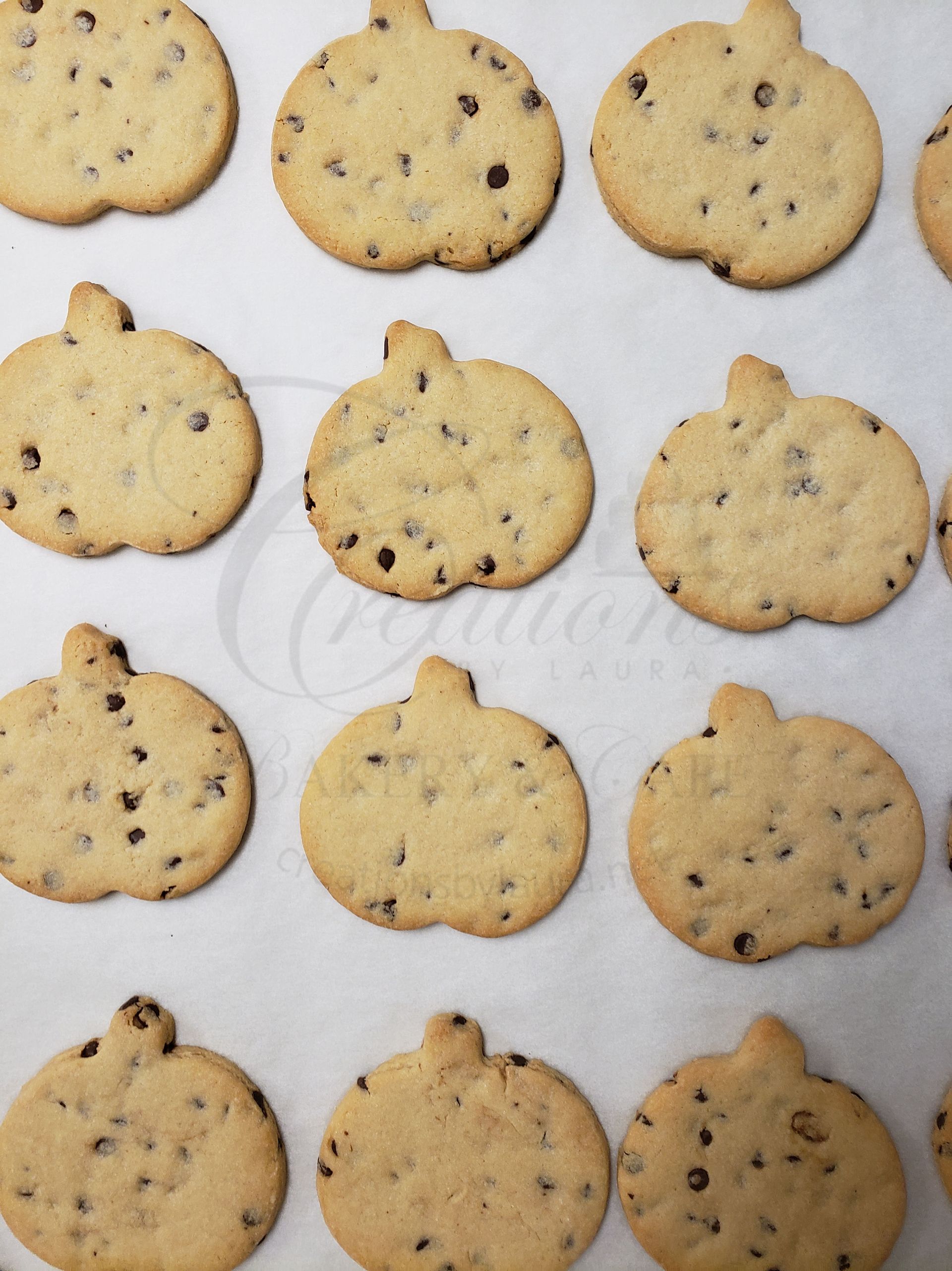 Cookies on a parchment-lined baking sheet, arranged in a grid.