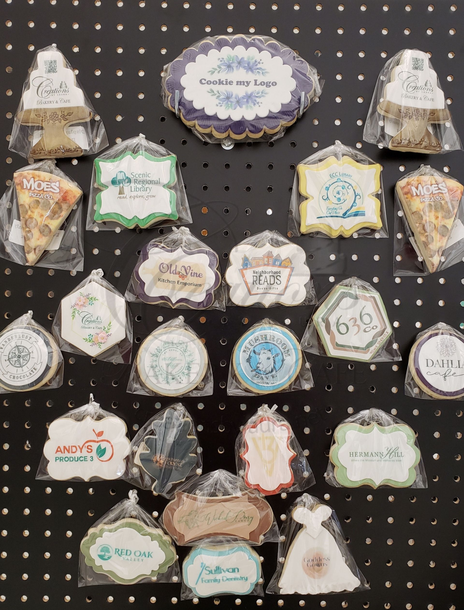 Assorted decorative Christmas-themed cookies and treats displayed on a black polka-dot background.