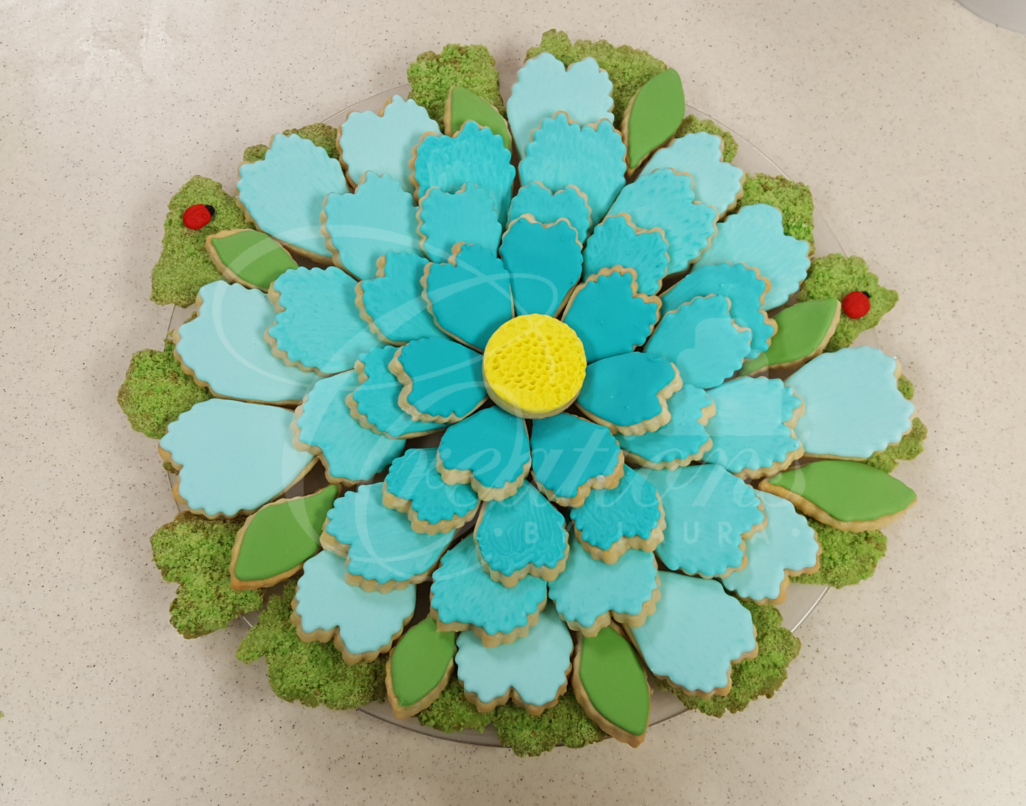 A flower made out of cookies with a yellow center