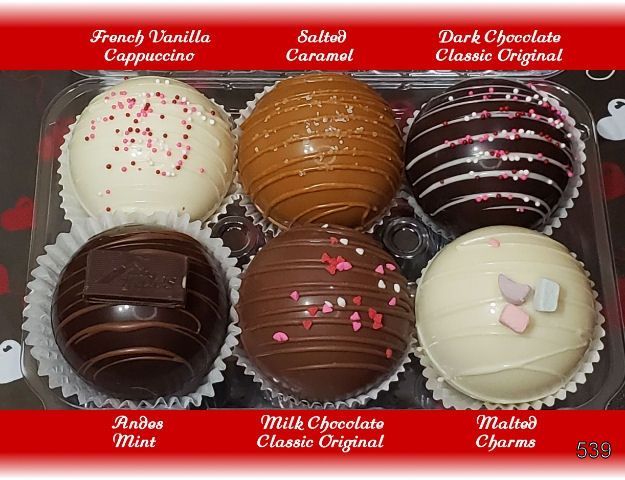 Assorted decorated chocolate truffles with flavor labels on a red background