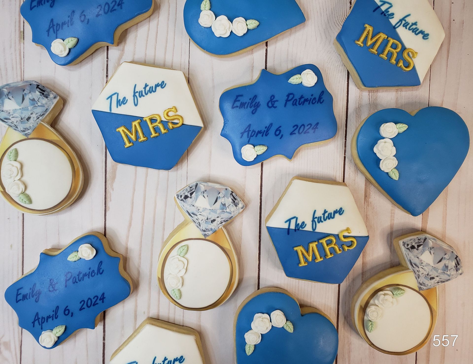 Blue-and-gold wedding cookies with “The future MRS” and “Mr. & Mrs.” designs on a white background