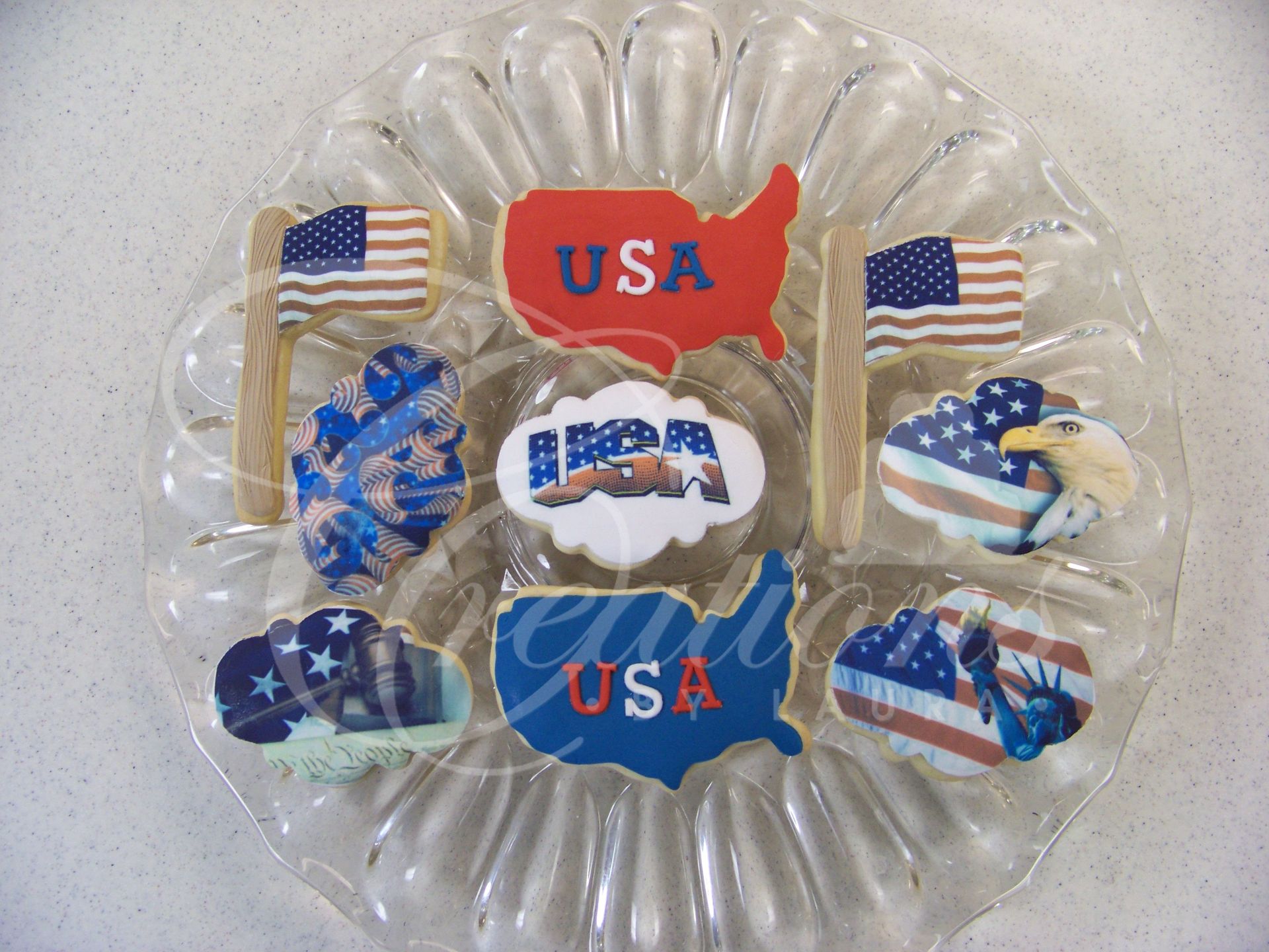 Patriotic USA-shaped candies in a clear plastic tray with red, white, and blue designs