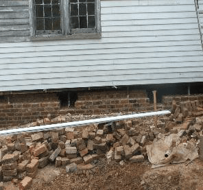 Old brick house with siding