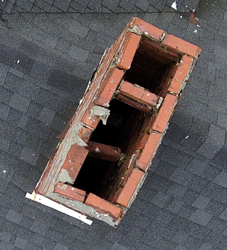 Aerial view of roof with chimney