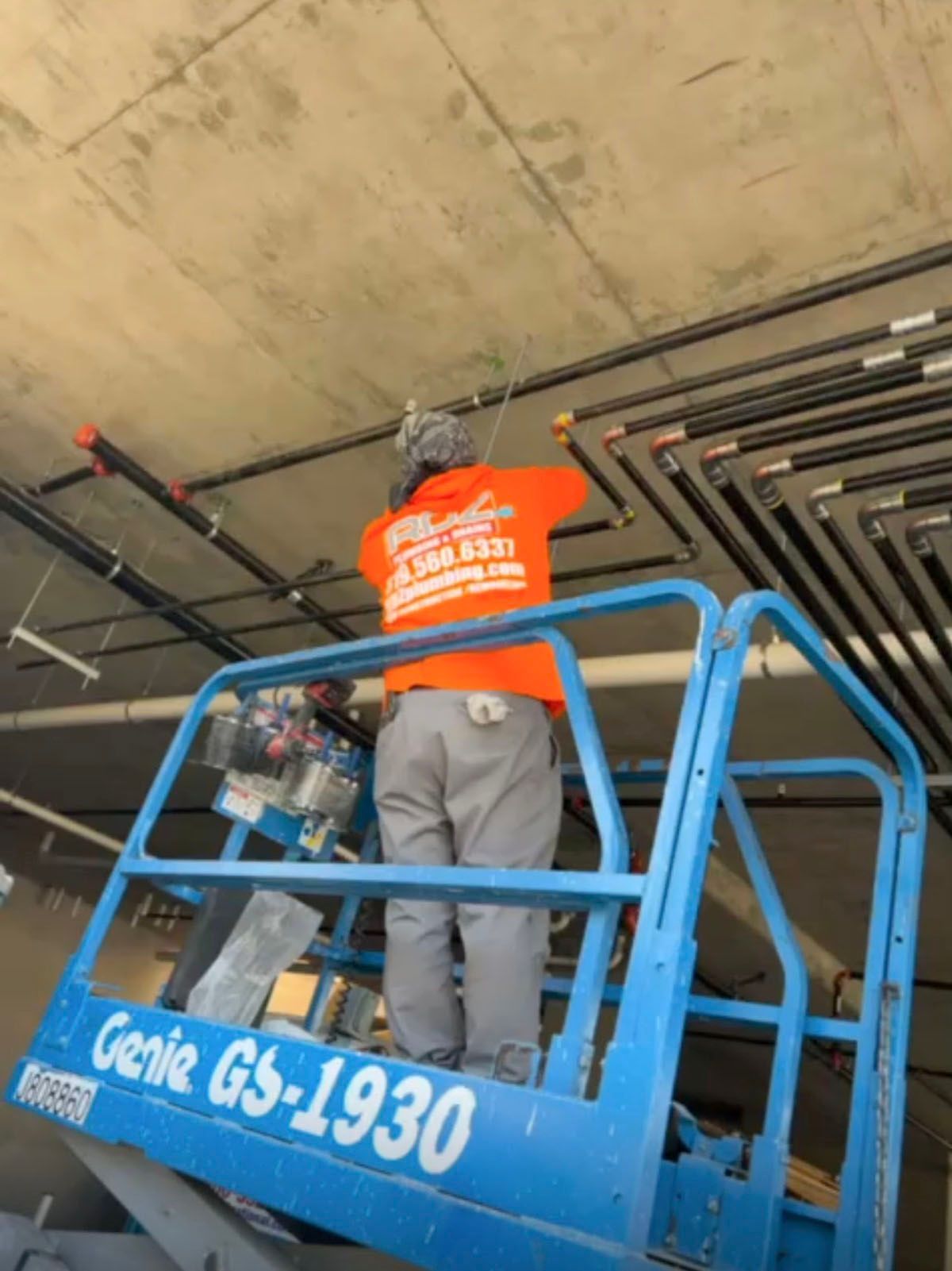 A man laying pipes