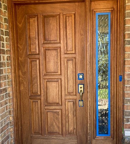 a wooden door with a blue tape 